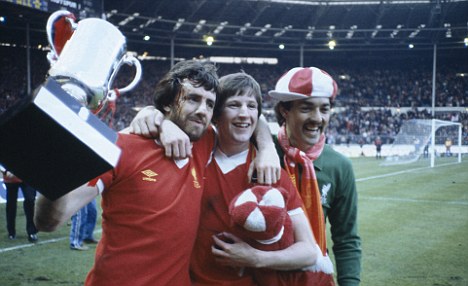 Mark Lawrenson, Ronnie Whelan, and Bruce Grobbelaar celebrate with the Milk Cup (sponsors trophy) after Liverpool had defeated Tottenham Hotspur 3-1 after extra time in the League Cup Final at Wembley Stadium, 13th March 1982. The League Cup was sponsored by the Milk Marketing Board. (Photo by Bob Thomas/Getty Images)