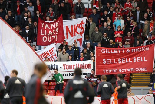 Liverpool fans protest against co-owners Tom Hicks and George Gillett in the stands after the final whistle as the Liverpool team warm down